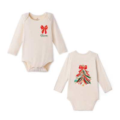 Two long-sleeve baby bodysuits in a soft cream color on a white background. The left bodysuit shows the front with a red bow graphic and the name 'Olivia' in green script.