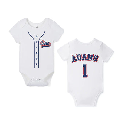 Two baby bodysuits with one displaying a baseball jersey design and the other showing the name 'ADAMS' and number '1'.