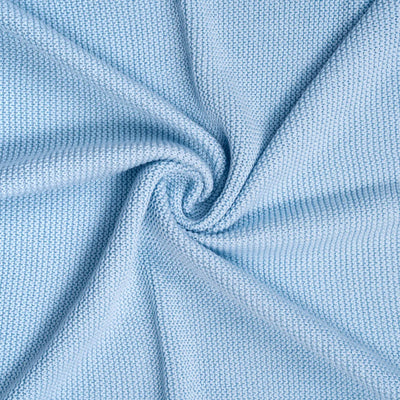 Close-up of light blue ruffle knitted baby blanket with a textured pattern