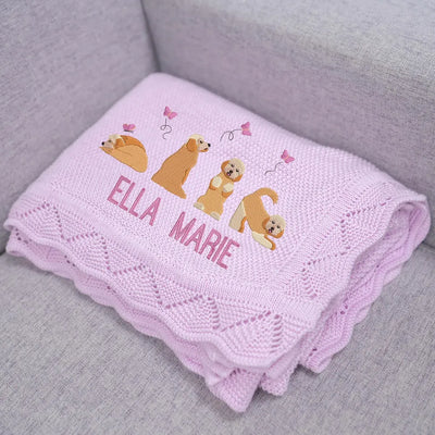 Lilac baby blanket with embroidered golden doodles and 'Ella Marie' text on a gray surface