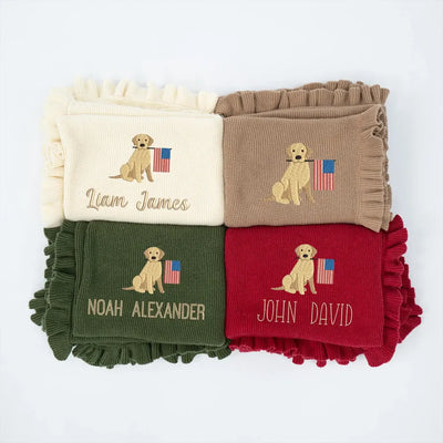 Four personalized baby blankets with embroidered patriotic golden retrievers and names on a white background
